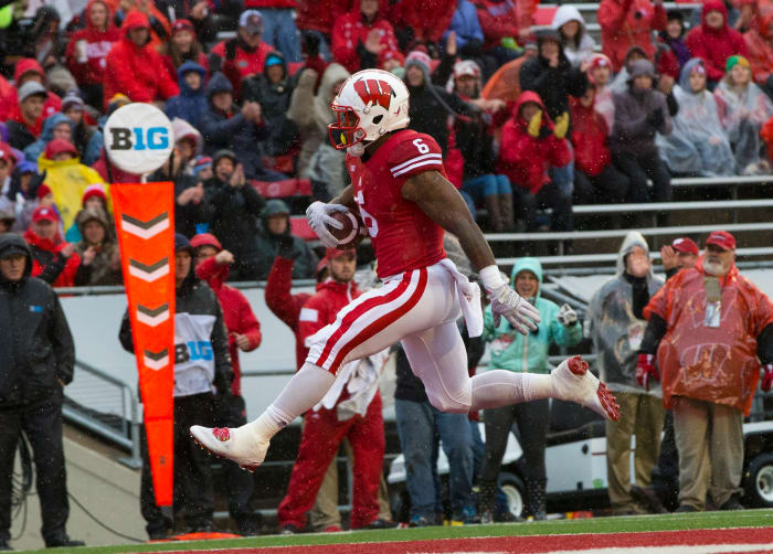 Oct 31, 2015; Madison, WI, USA; Wisconsin Badgers running back Corey Clement (6) rushes for a touchdown during the first quarter against the Rutgers Scarlet Knights at Camp Randall Stadium. Mandatory Credit: Jeff Hanisch-USA TODAY Sports
